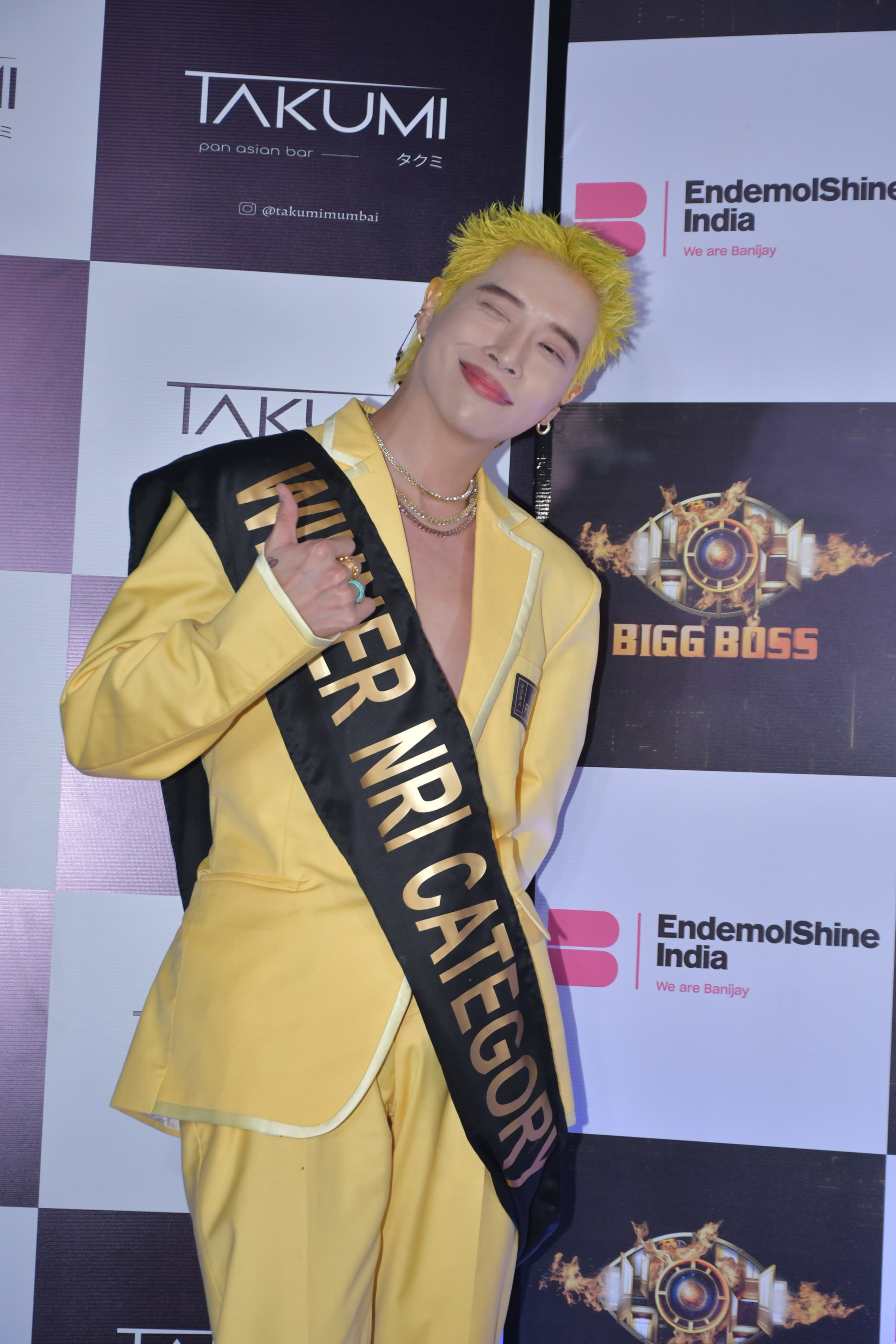 Korean singer Aoora donned an elegant yellow pant suit and also wore a funny sash which had 'Winner NRI Category' written on it